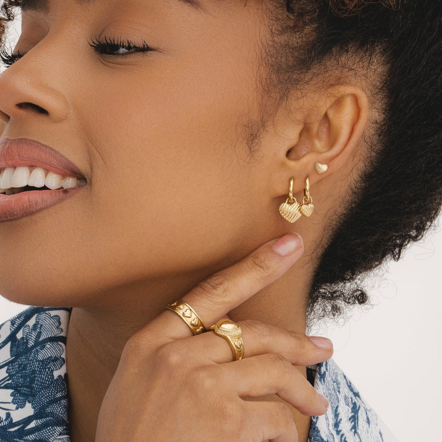 Gold huggie heart earrings